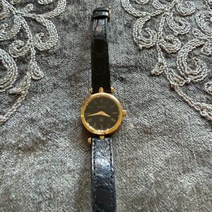 Gucci Black and Gold Logo Watch